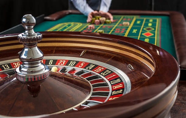 Asia Gaming roulette table interface on enjin showing live wheel spin, betting zone, and player chat
